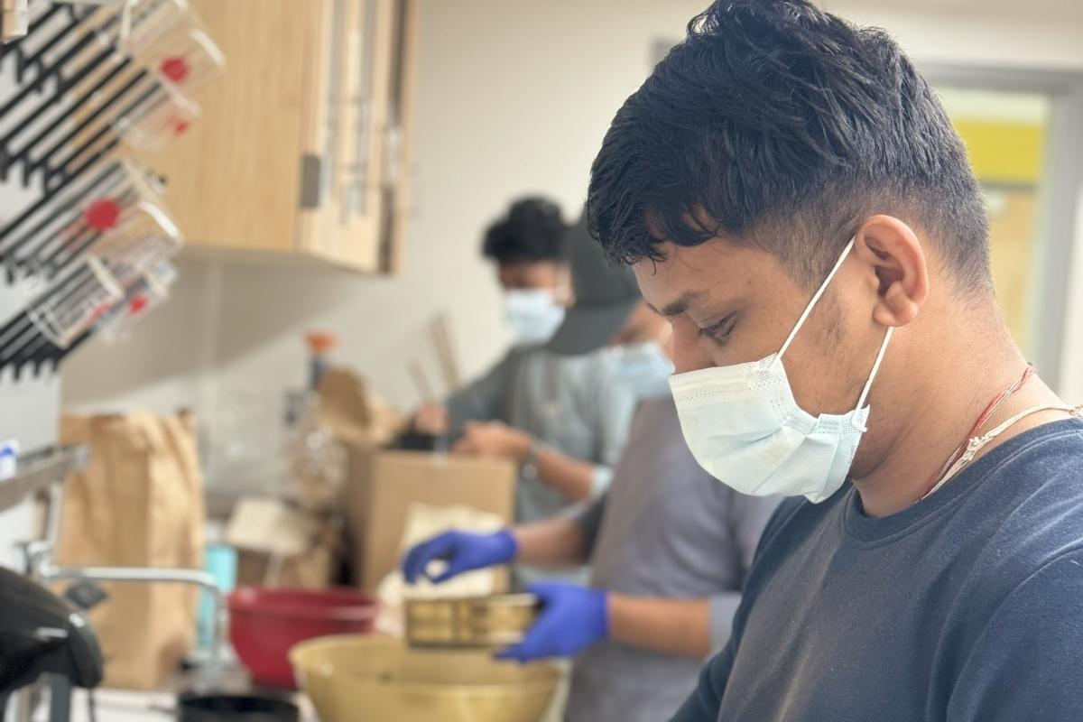 Agronomy lab crew cleaning seed for further lab test