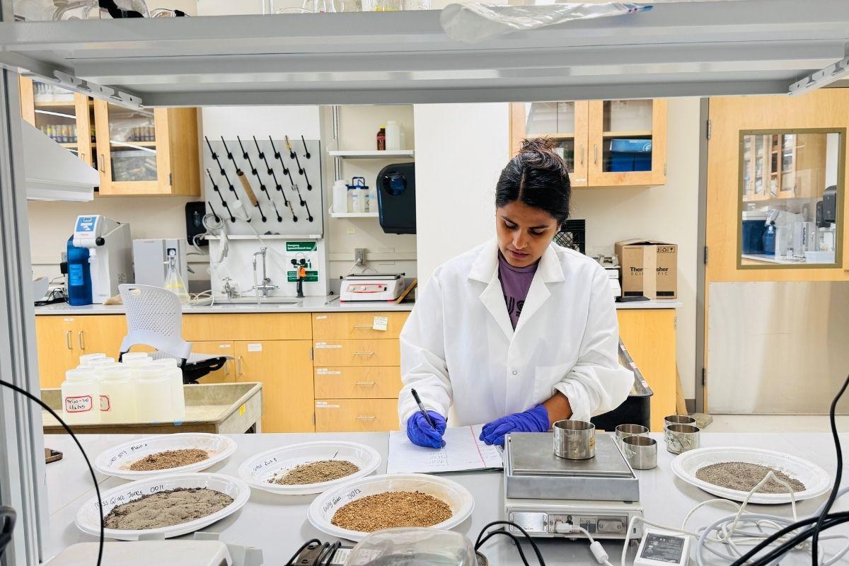 Srijana recording soil data for her research