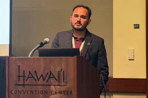Suraj presenting his work in AAG 2024