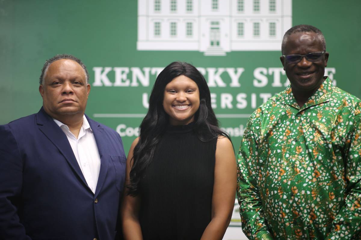 Three people smiling